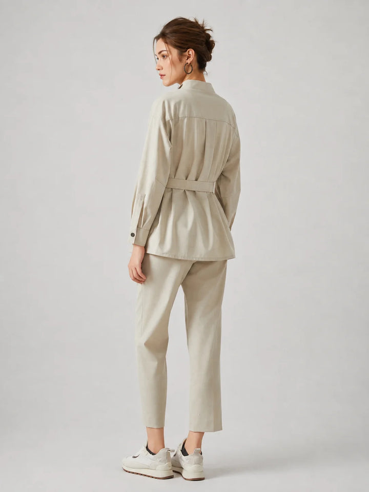 Wool slim trench coat, light cream, back view with belt and buttoned cuffs.