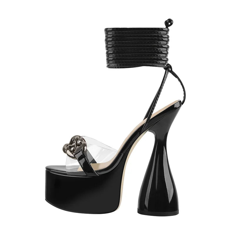 Open-toe spike-heel sandals with clear strap, black platform sole, and glossy spike heel