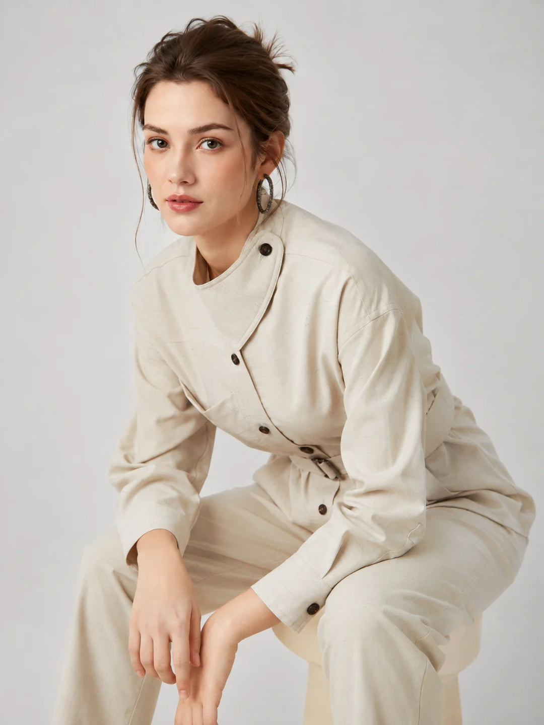 Wool slim trench coat, light cream, belted waist with button details.