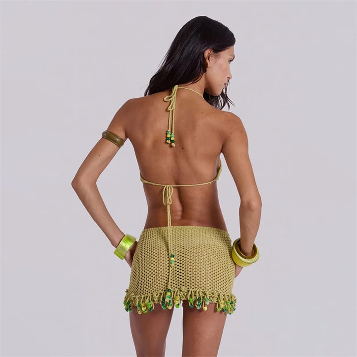 Back view of army green crochet knit bikini cover-up with crisscross tie straps