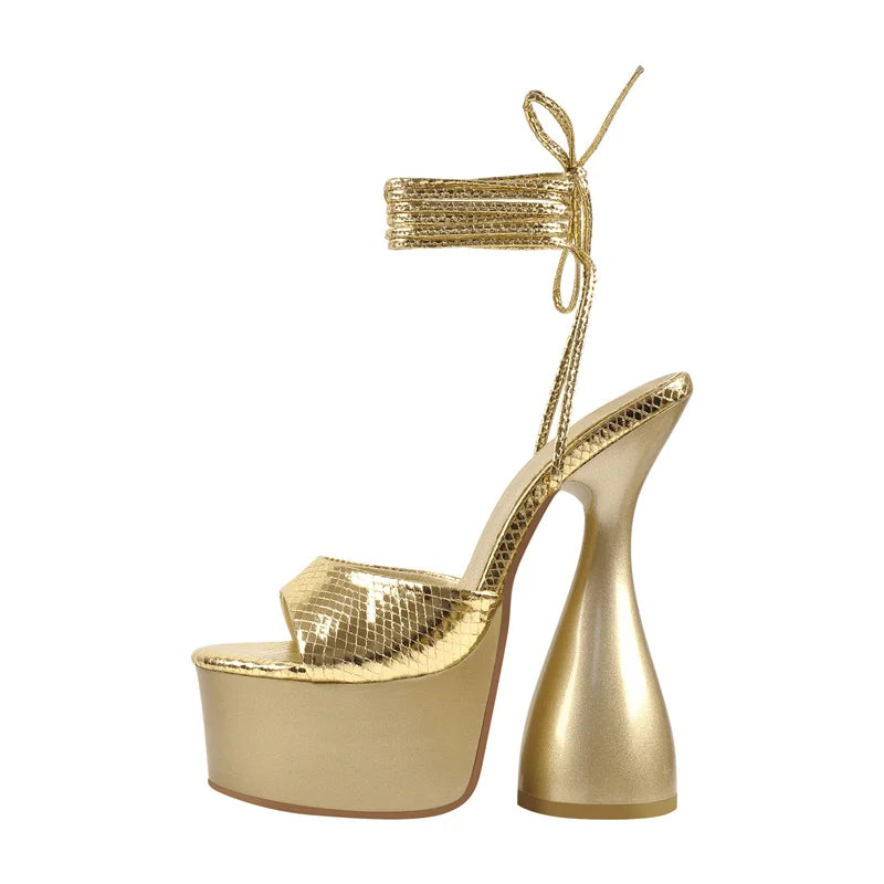 Open-toe spike-heel sandals in gold metallic with platform sole and ankle tie