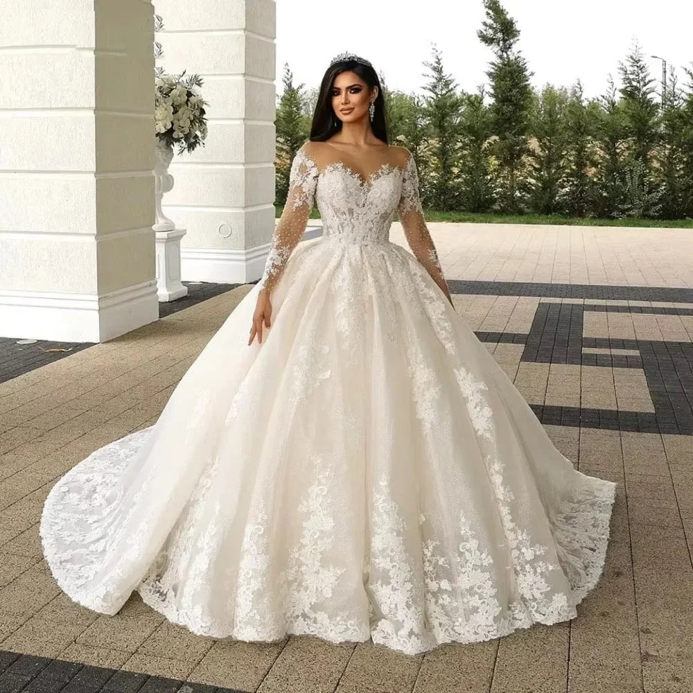 White lace and beaded bridal ball gown with off-shoulder sleeves and full skirt