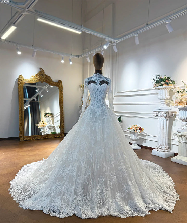Ivory lace A-line wedding dress with sweetheart neckline, drop waist, and lace hem