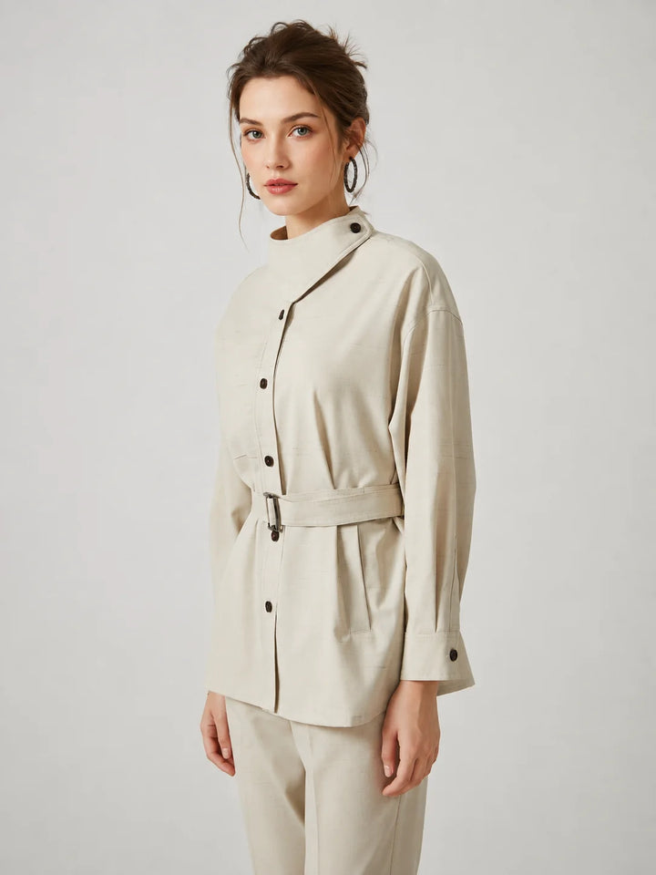 Wool slim trench coat in light cream, side view, button placket and tied belt.