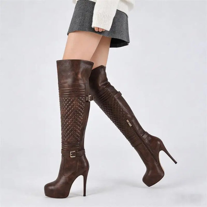 Brown over-the-knee boots with quilted panel detail and stiletto heel.