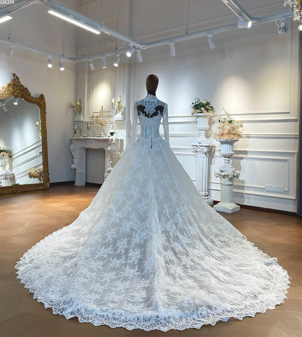 Women’s lace A-line wedding dress from back view with full tulle skirt and lace trim