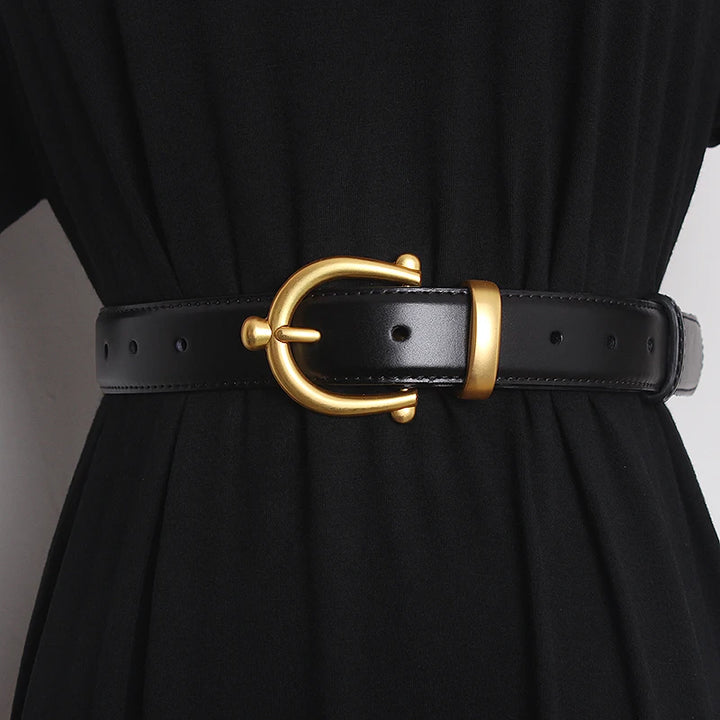 Black leather waist belt with gold-tone buckle ring and punched adjustment holes