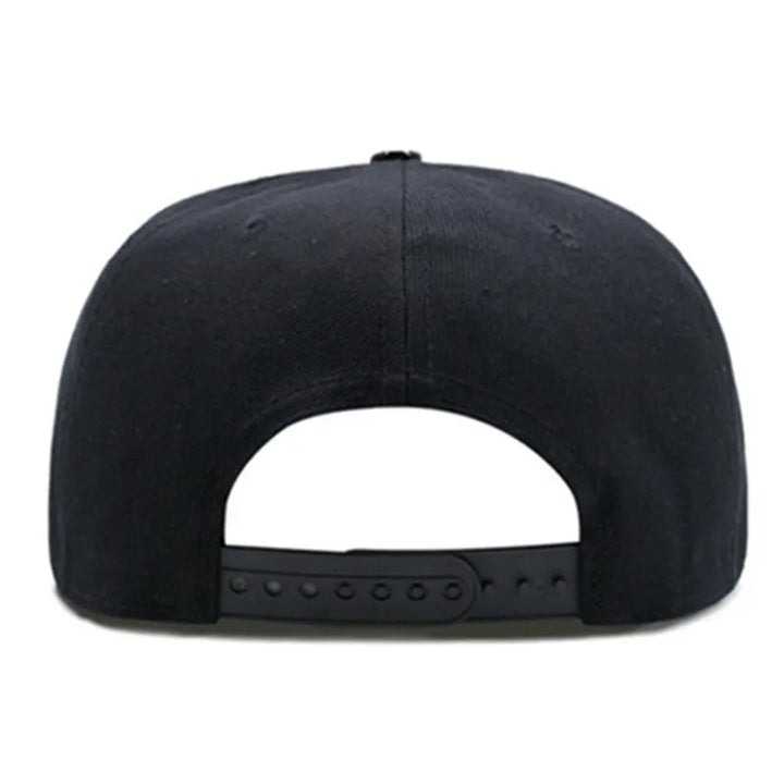 Black flat brim cap with simple crown panel and studded strap band on brim