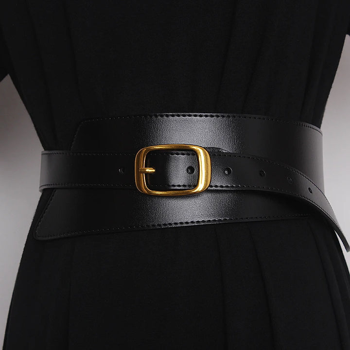 Black leather corset belt with gold-tone buckle, stitched trim and side adjustment holes