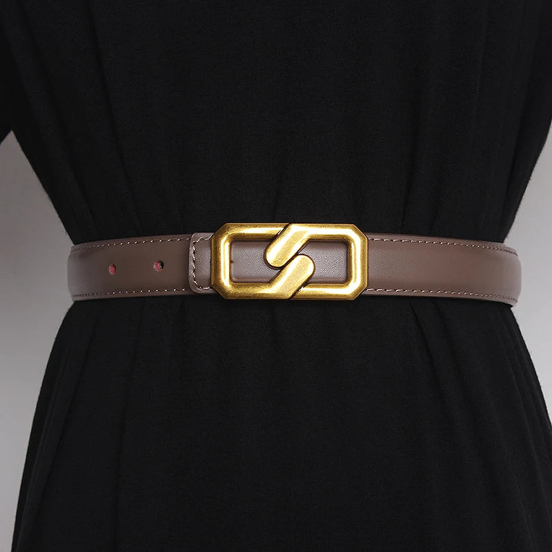 Tan genuine leather women’s belt with gold-tone buckle and punched holes
