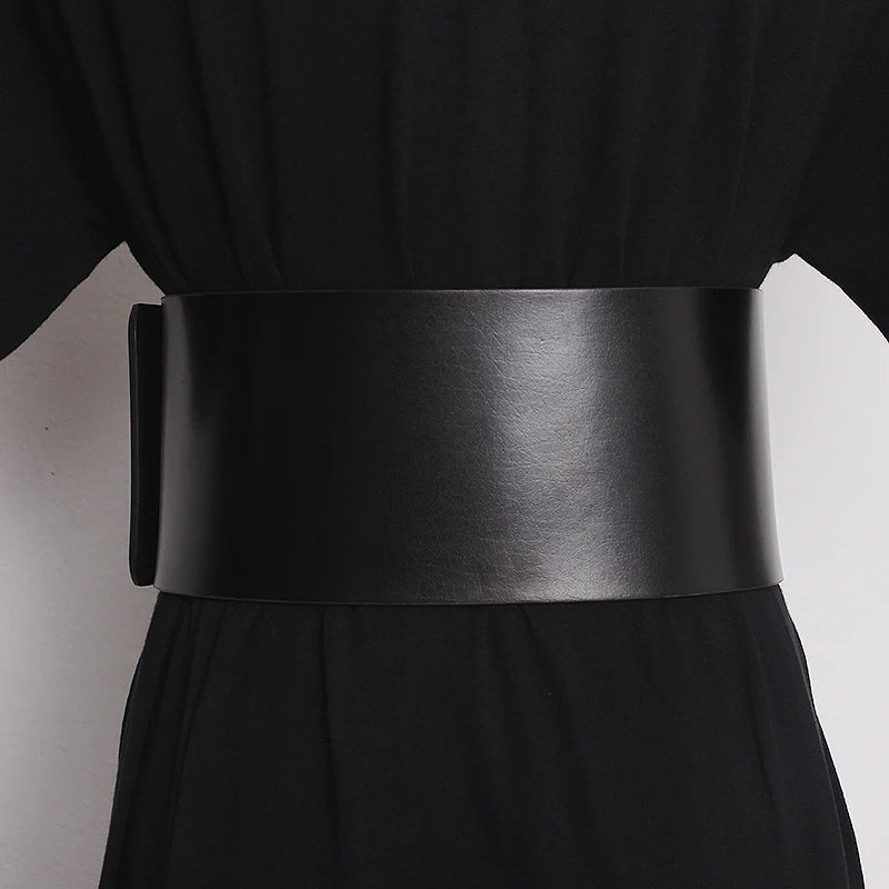 Black wide leather belt with smooth wide strap and buckle end