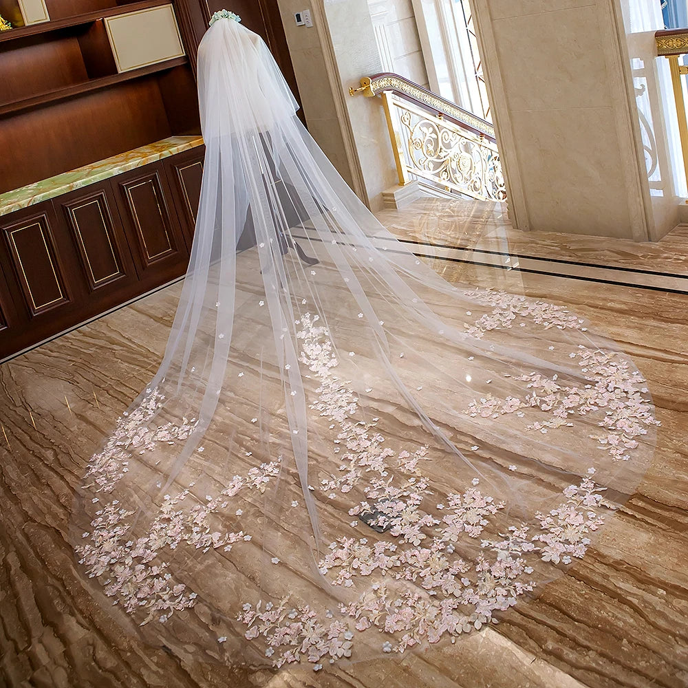 Bridal veil with floral embellishments on a marble floor