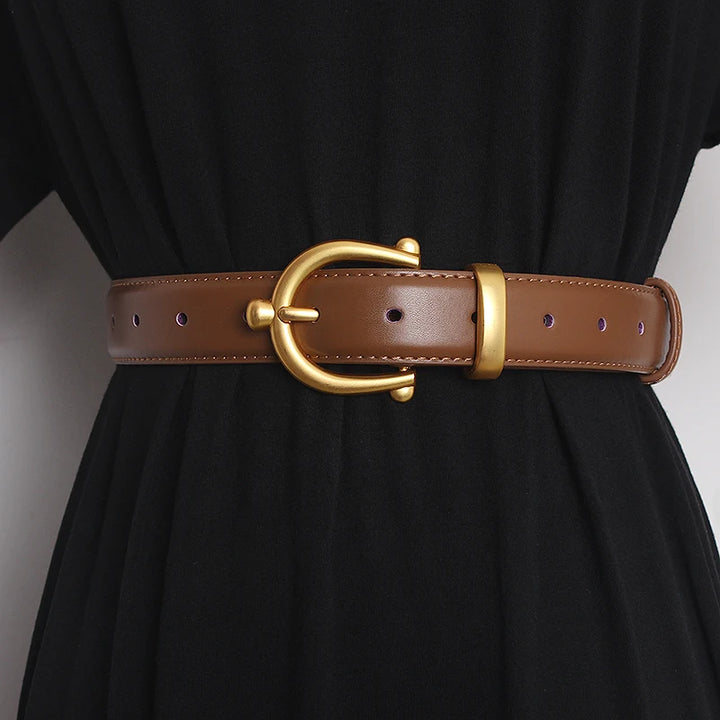Women’s leather waist belt in brown with round gold buckle and punched adjustment holes