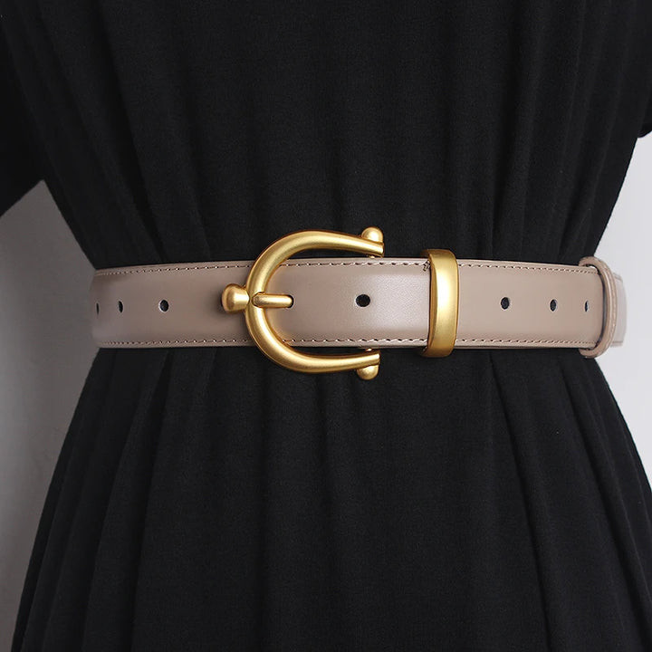 Light beige leather waist belt with gold-tone buckle ring and punched adjustment holes