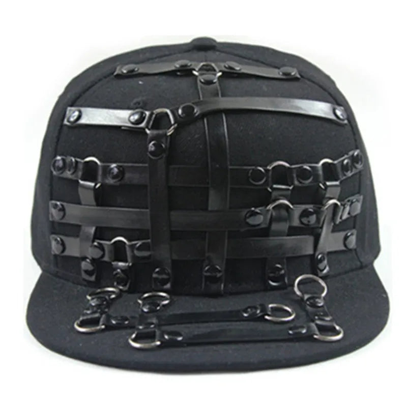 Black flat brim hat with strap lattice panel and metal ring and buckle embellishments