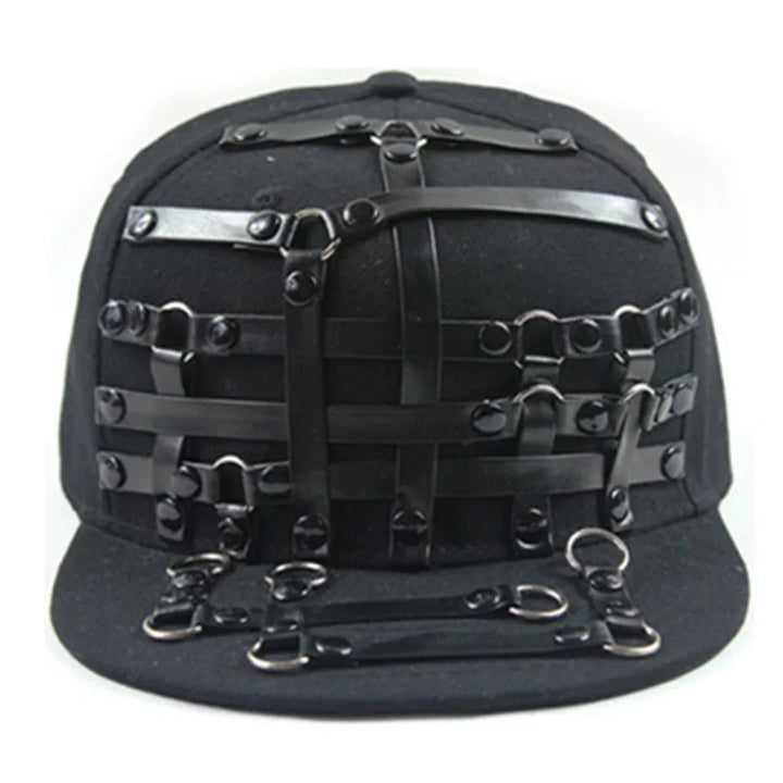 Black flat brim hat with strap lattice panel and metal ring and buckle embellishments