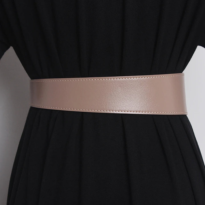 Light khaki leather wide waist belt, straight strap with no visible buckle