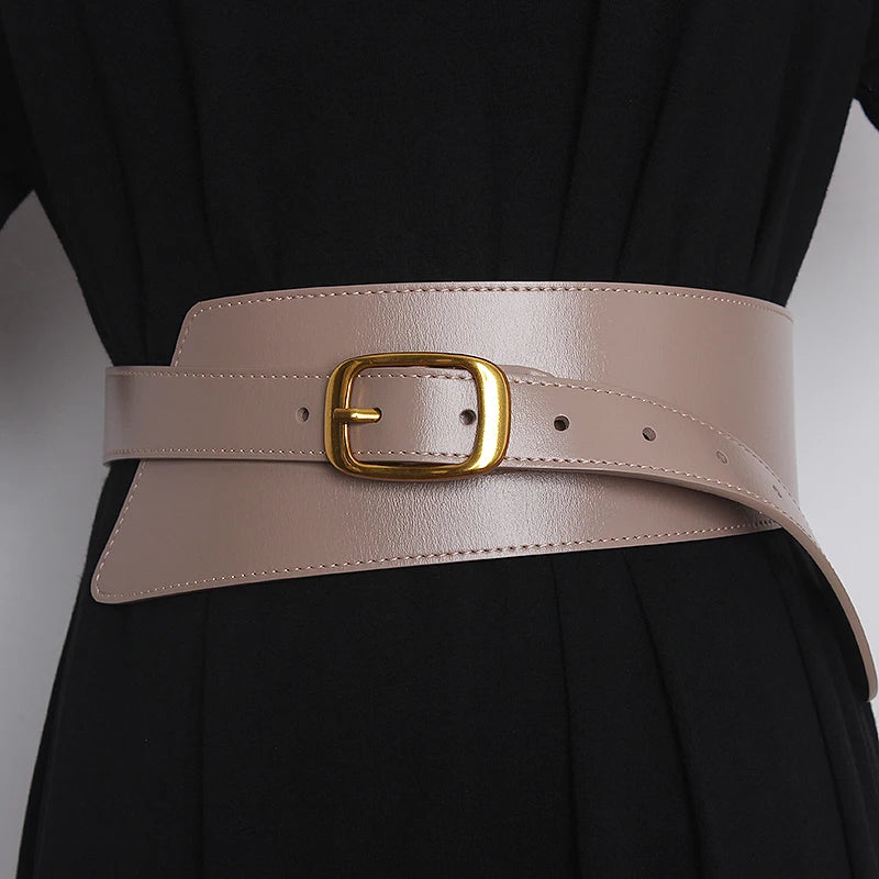 Light khaki leather corset belt with gold-tone buckle and stitched edge, adjustable holes