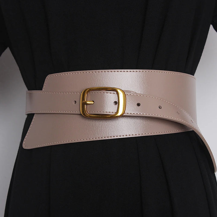 Light khaki leather corset belt with gold-tone buckle and stitched edge, adjustable holes