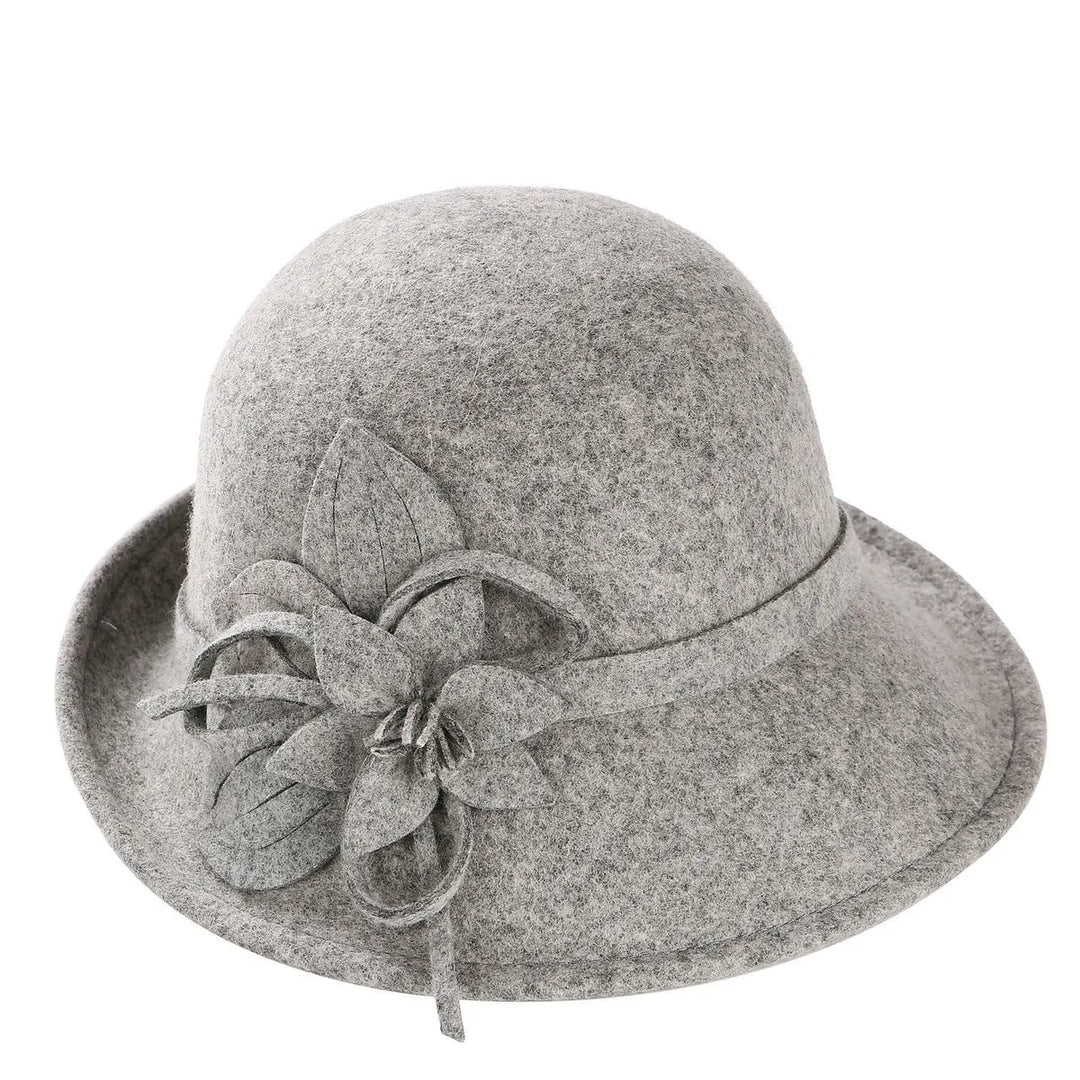 Gray wool pillbox hat with layered fabric flower and trailing bow detail