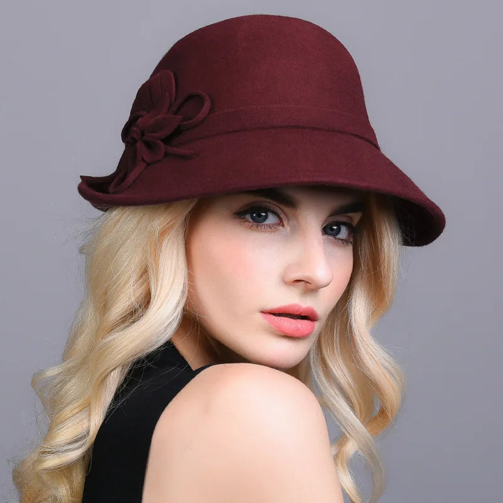 Burgundy wool pillbox hat with fabric flower and side bow detail