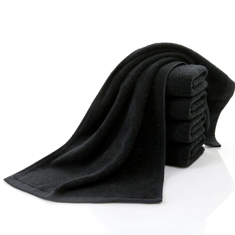 Black cotton face towel set with folded terry cloth towel, soft and absorbent