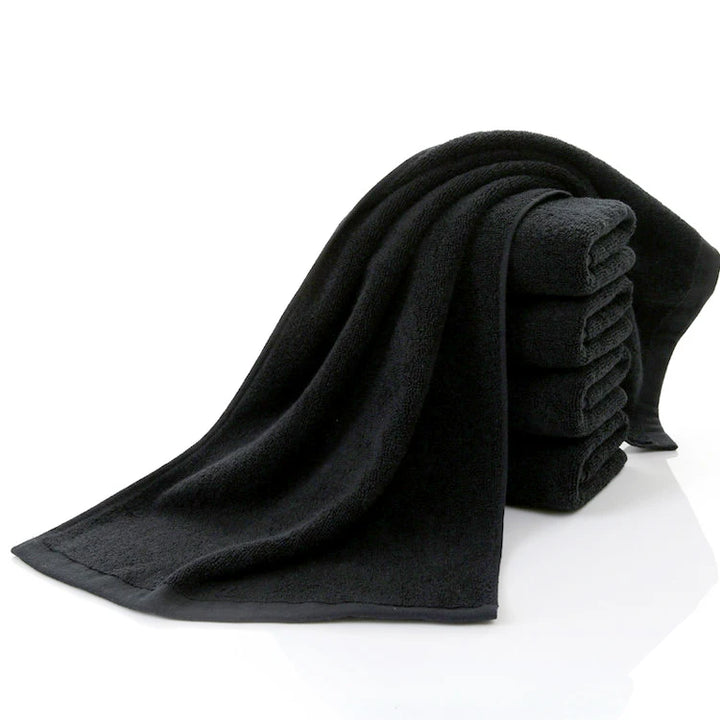 Black cotton face towel set with folded terry cloth towel, soft and absorbent