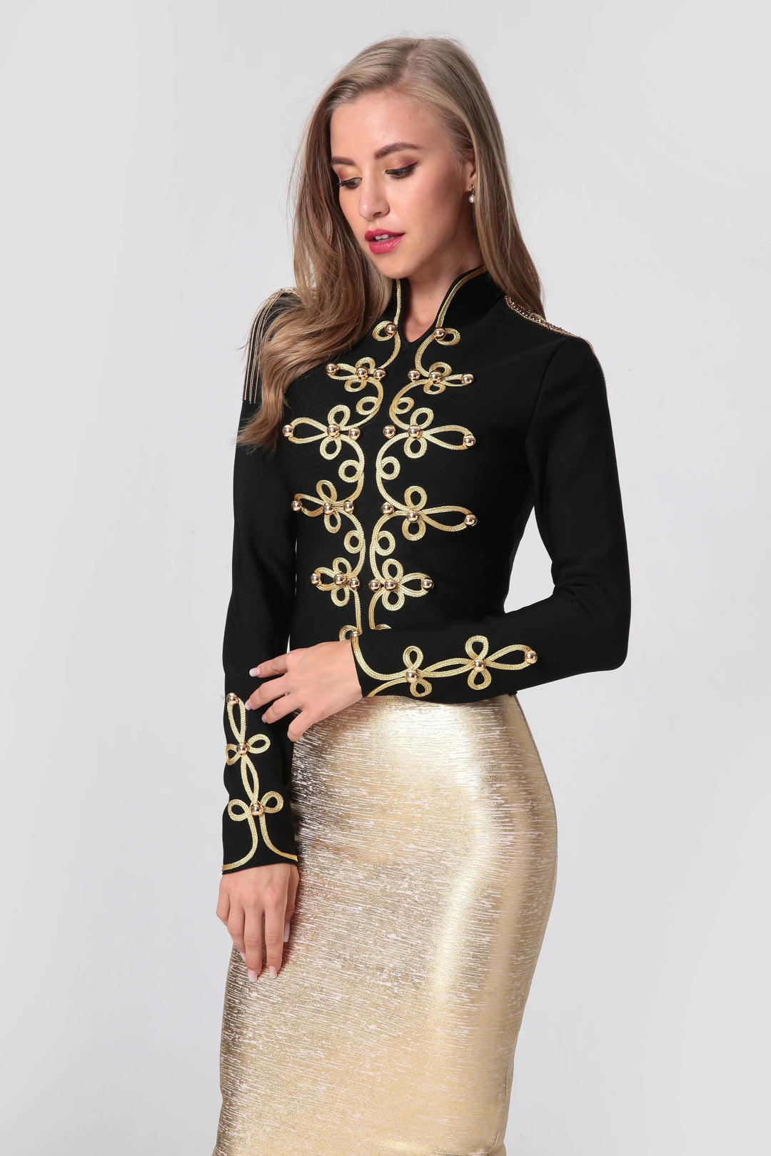 Black long-sleeve jacket with gold embroidered scrolls on chest and sleeves