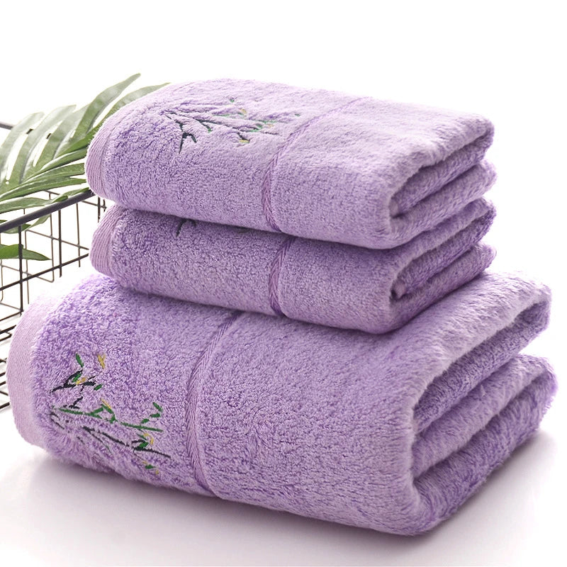 Thick bamboo-fiber bath towel set in purple, folded with embroidered bamboo leaf