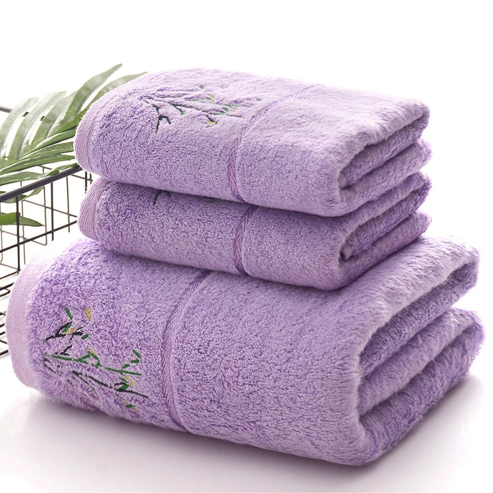 Thick bamboo-fiber bath towel set in purple, folded with embroidered bamboo leaf