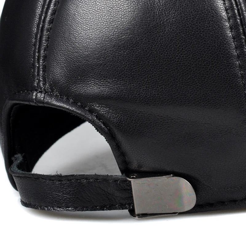 Black leather cap interior with adjustable strap and open crown opening
