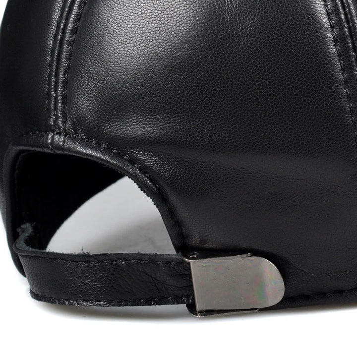 Black leather cap interior with adjustable strap and open crown opening