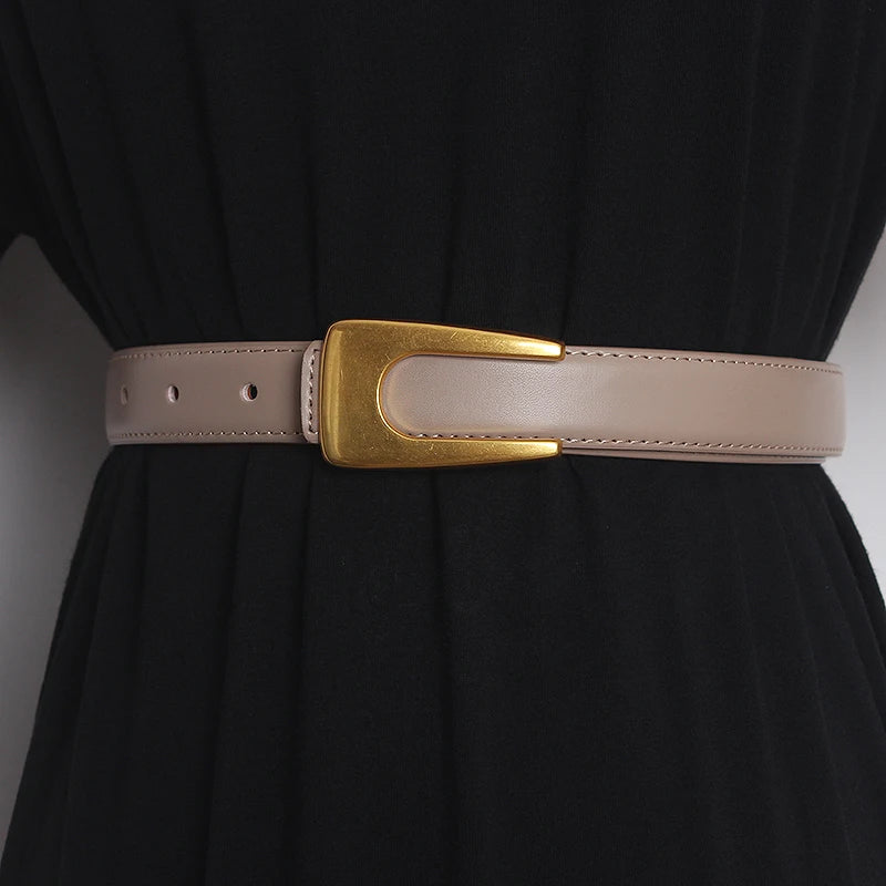 Narrow light beige leather waist belt with gold-tone rectangular buckle and adjustment holes