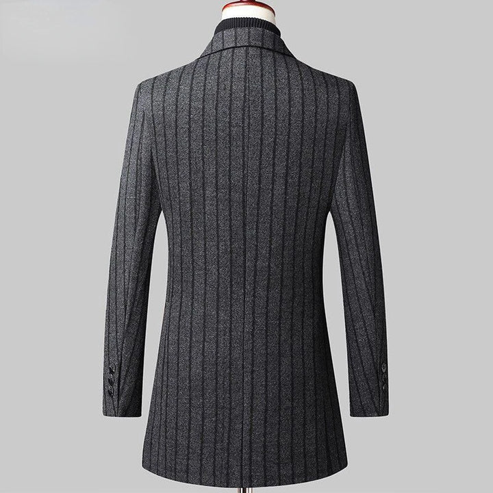 Gray textured coat on a mannequin against a gray background