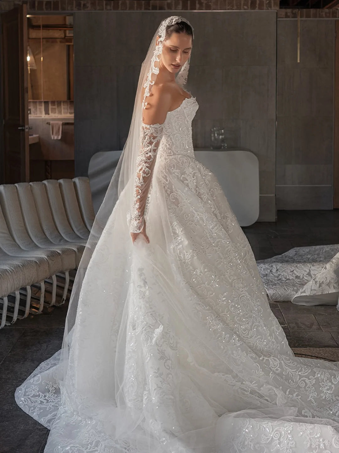White bridal lace gown with floral embroidery, sweetheart neckline, high slit, sheer veil