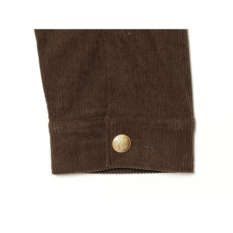 Brown cropped jacket cuff with gold button closure and textured fabric