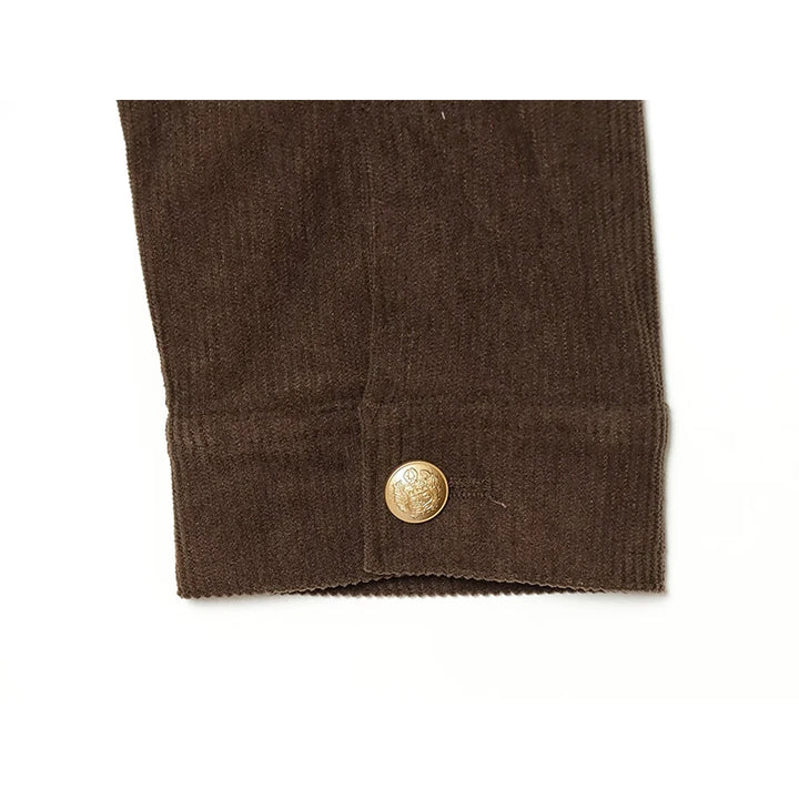 Brown cropped jacket cuff with gold button closure and textured fabric