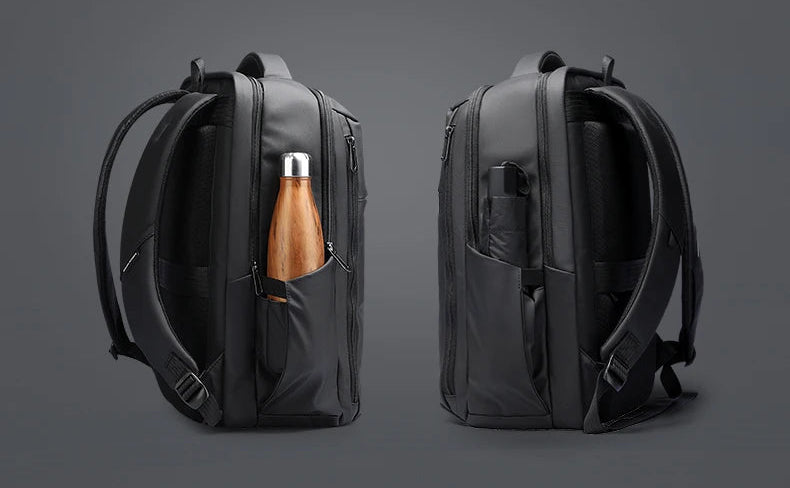 Elite grey Oxford laptop backpack with front pocket, side bottle pocket, and dual zippers