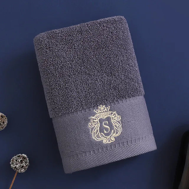 Cotton bath towel, charcoal gray with gold embroidered crest