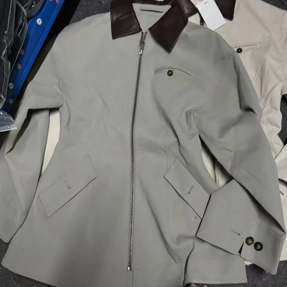 Women’s light gray-green lapel zipper jacket detail view with brown-trim collar