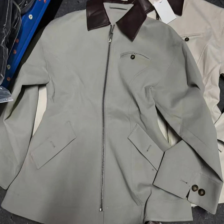 Women’s light gray-green lapel zipper jacket detail view with brown-trim collar