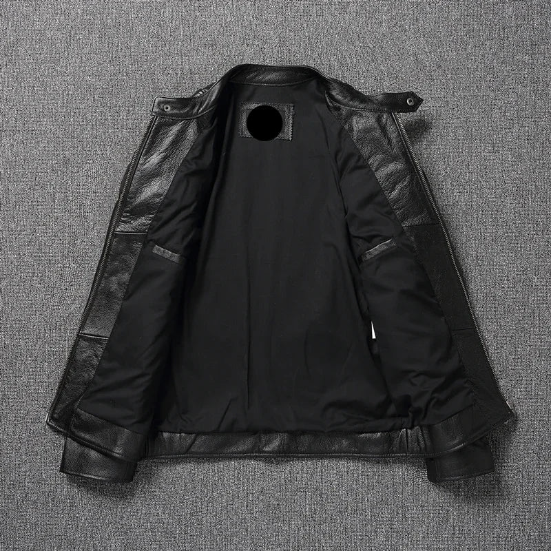 Black leather jacket with a brand label on a gray textured background