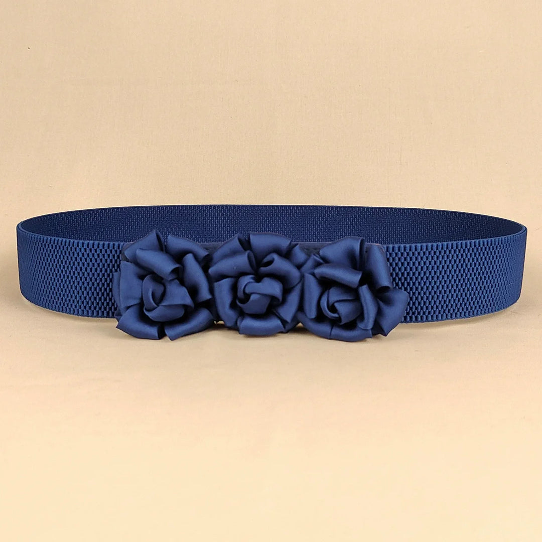 Navy corset waist belt with three fabric flower appliques across the front