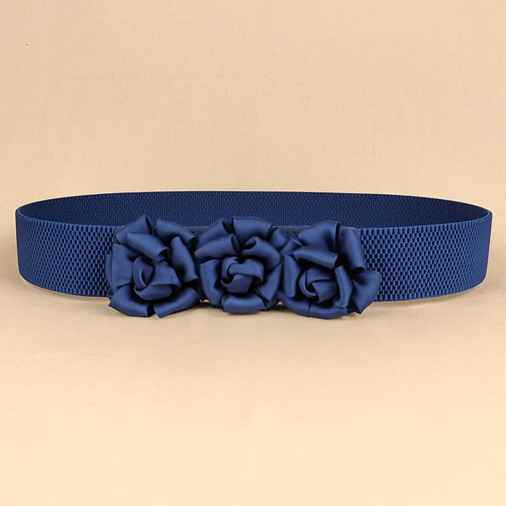 Navy corset waist belt with three fabric flower appliques across the front