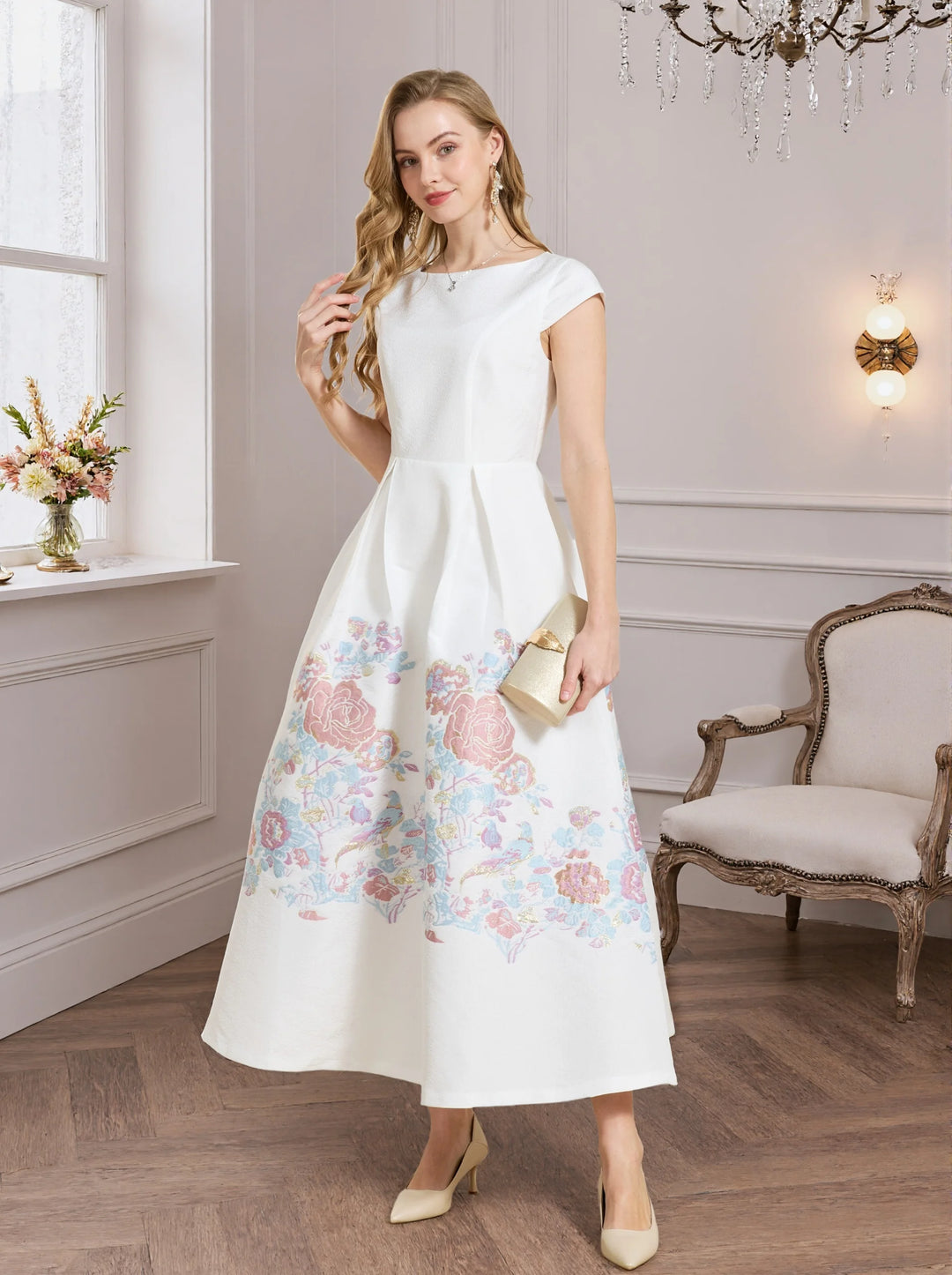 White A-line prom dress with pastel floral print hem and short sleeves, angled view
