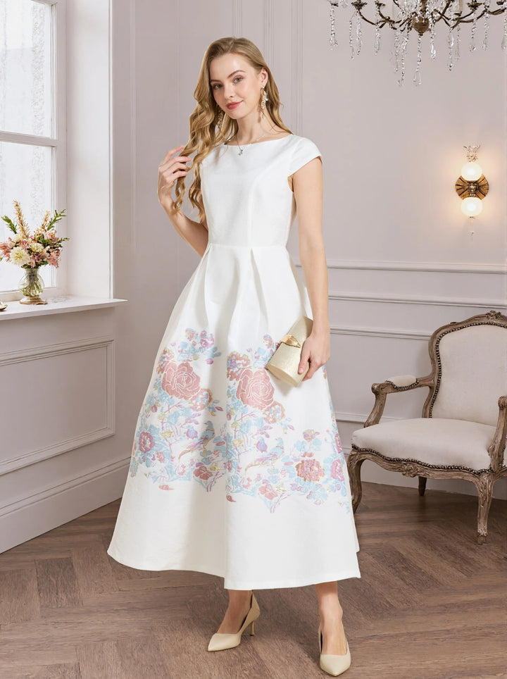 White A-line prom dress with pastel floral print hem and short sleeves, angled view