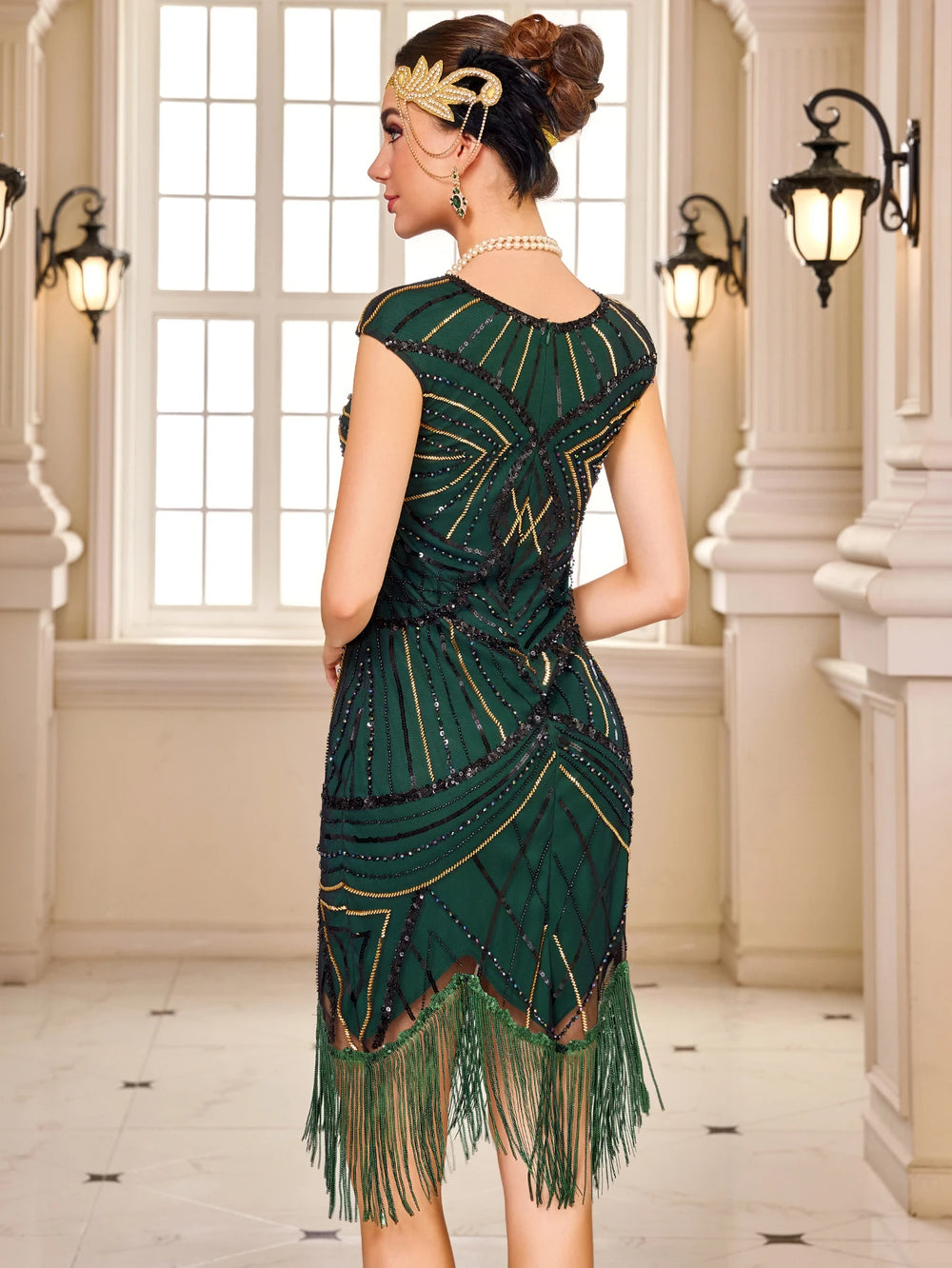 Back view of dark green sequin flapper dress with fringe hem and beaded straps