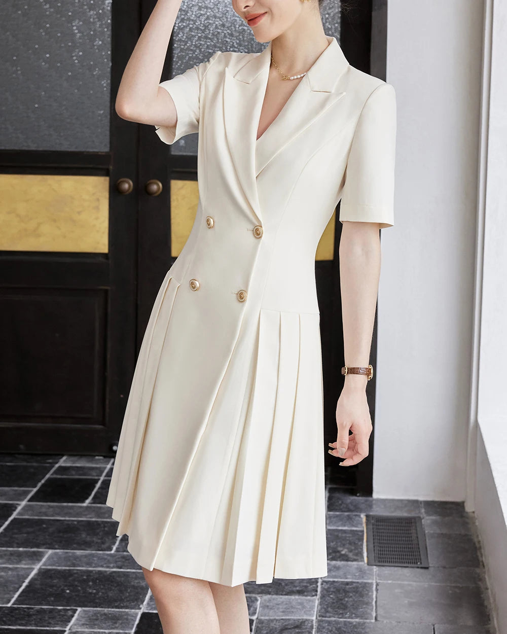 Beige double-breasted A-line dress, notched collar, short sleeves, pleated panels