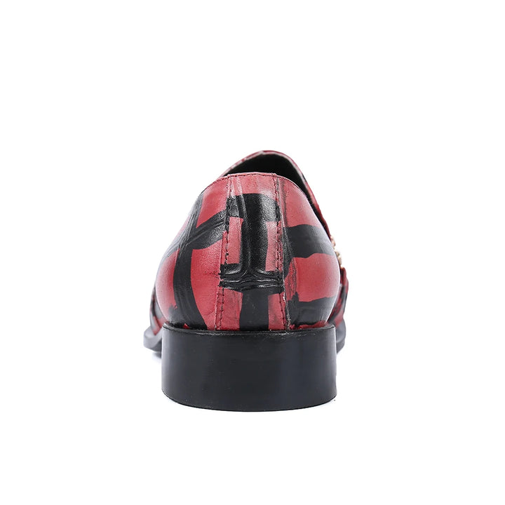 Back view of red and black striped pointed-toe loafer with low block heel