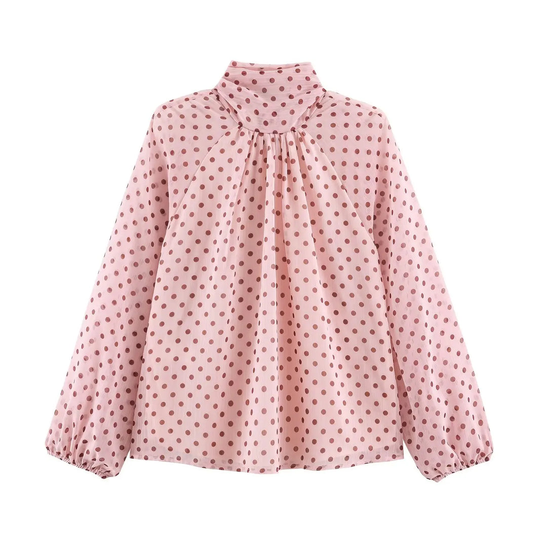Pink polka-dot high-neck chiffon blouse with gathered front and long puff sleeves